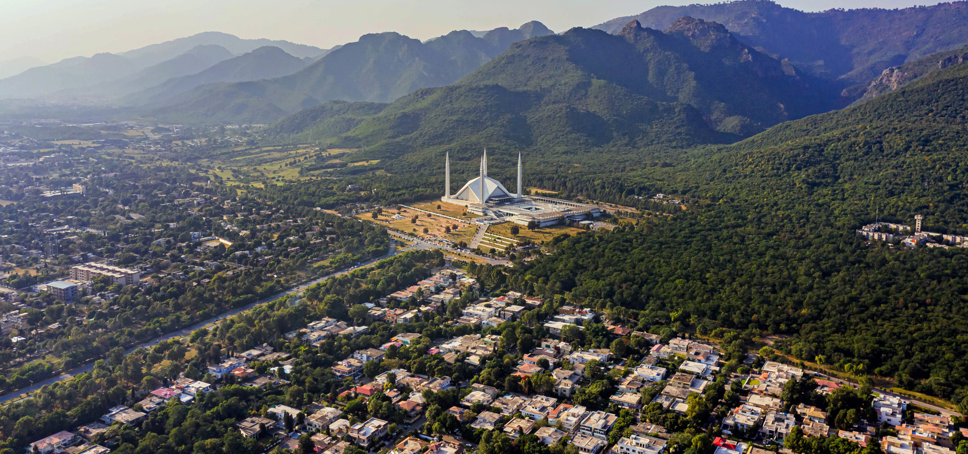 View of the Shah Faisal Mosque in Islamabad at the foot of the Margalla Hills.